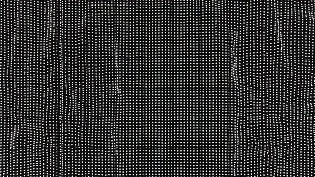 Abstract black and white image featuring a dense pattern of white dots on a dark background