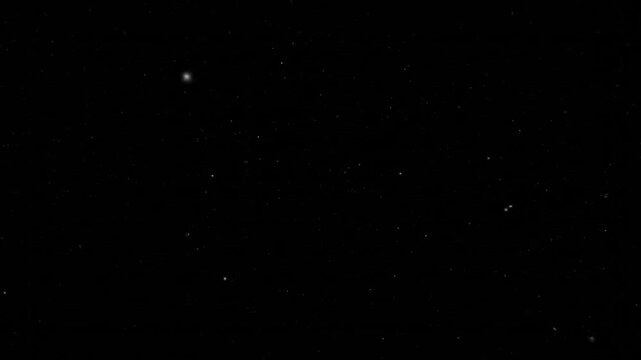 Gazing upward at a tranquil night sky, the observer captures a high‑resolution view of scattered stars across a deep black void, highlighting the celestial wonder of a starry night scene