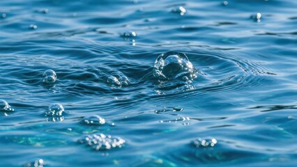 Close-up of water's surface with bubbles, a serene, vibrant scene