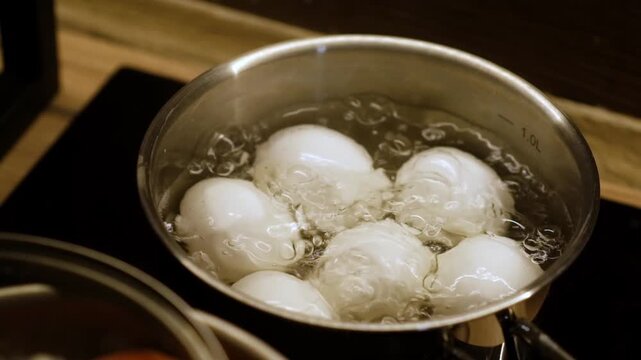Boiling six eggs in a pot of water on the stovetop, a simple method to prepare delicious and nutritious eggs for any meal.
