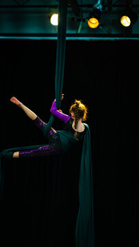 Girl acrobat in aerial show