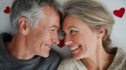 Forever Connected: A tender moment shared between a senior couple, their faces illuminated with the warmth of love and happiness, symbol of lifelong companionship. 