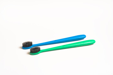 A two toothbrush on white background with copy space, close-up, top view. Dental oral hygiene concept