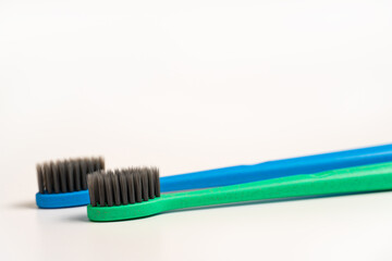 A two toothbrush on white background with copy space, close-up, selective focus. Dental oral hygiene concept