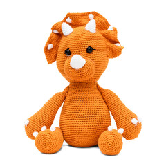 Plush triceratops dinosaur sitting down, made using amigurumi crochet technique. Transparent background. © DR Moura