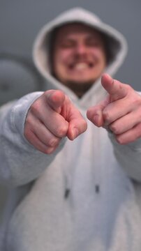 Humiliation and bullying.
Mocking and humiliation.
A person insults someone and makes fun of them.
An angry man mocks and looks at the person he insulted with contempt.