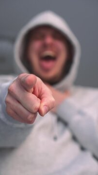 Humiliation and bullying.
Mocking and humiliation.
A person insults someone and makes fun of them.
An angry man mocks and looks at the person he insulted with contempt.