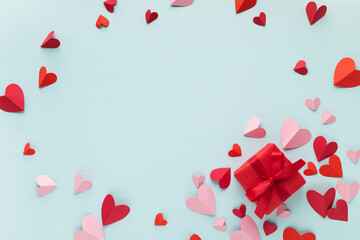 Valentine or Mother Day gift box decorated with pink and red love hearts top view. Beautiful...