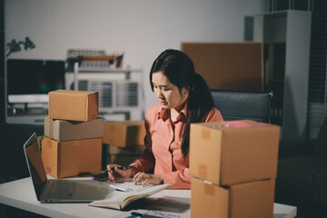 Startup, small business, SME owner check online orders. data logging Business growth, selling products, working with boxes. freelance work at home office online sme business small organization