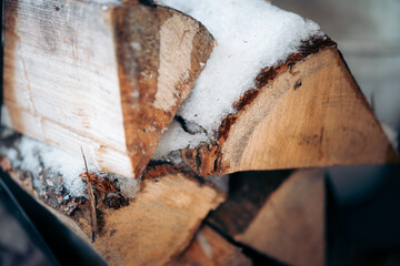 firewood covered with snow