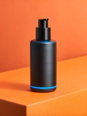 Modern dark bottle with pump on orange background
