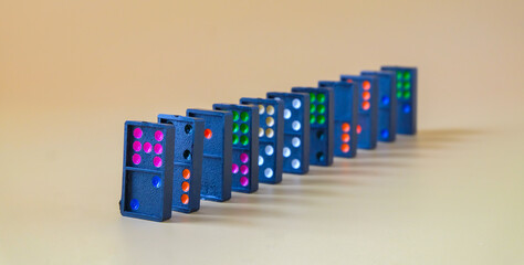 Dominoes game on a color background.Selective focus.