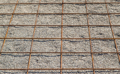 Knitting metal reinforcement for a swimming pool. Selective focus.
