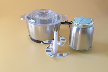 Set of food grinder for minced beef and vegetables on background.