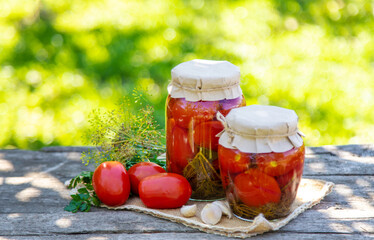 Preserving tomatoes in a jar. Selective focus.