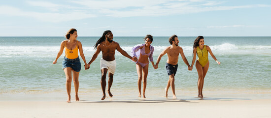Friends enjoying time together at the beach on a sunny day