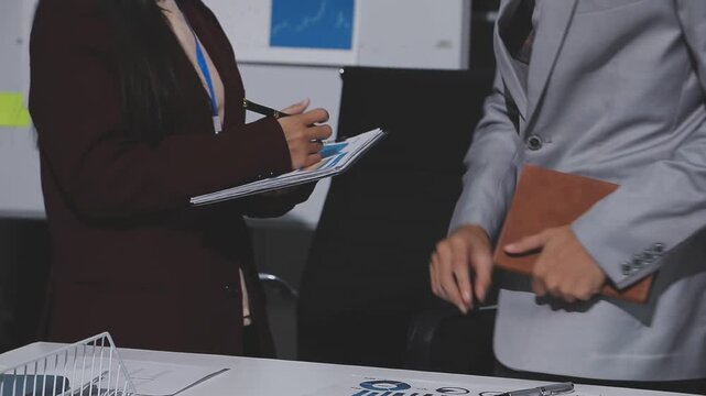 Asian male financial officer or accountant checking investment results Financial budget analysis Planning to summarize results and report to the meeting Audit concept and investment results.