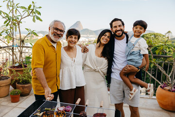 Fototapeta na wymiar Latin family enjoying a Brazilian churrasco with scenic views in the background
