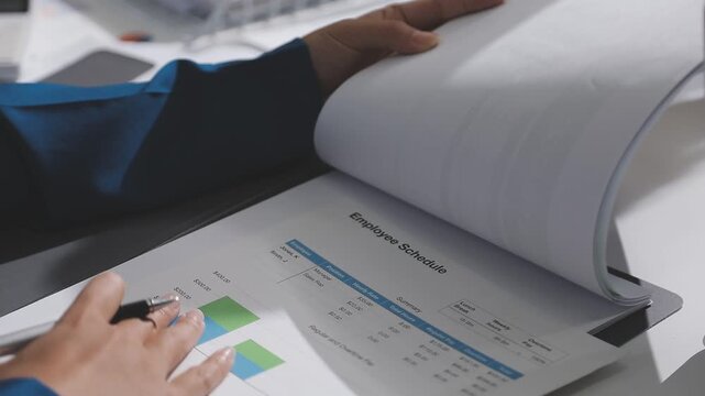Asian male financial officer or accountant checking investment results Financial budget analysis Planning to summarize results and report to the meeting Audit concept and investment results.
