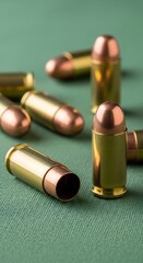 Ammunition Close-Up - Bullets on Green Surface.