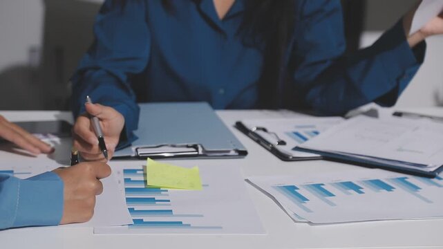 Asian male financial officer or accountant checking investment results Financial budget analysis Planning to summarize results and report to the meeting Audit concept and investment results.