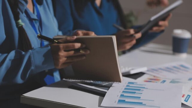 Asian male financial officer or accountant checking investment results Financial budget analysis Planning to summarize results and report to the meeting Audit concept and investment results.