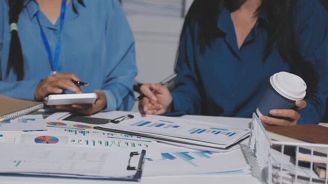 Asian male financial officer or accountant checking investment results Financial budget analysis Planning to summarize results and report to the meeting Audit concept and investment results.