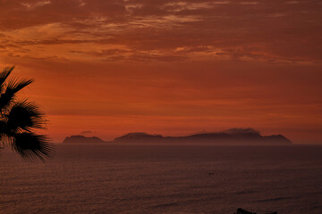 breathtaking dusk over the Costa Verde as the sun sets behind San Lorenzo Island. This stunning...