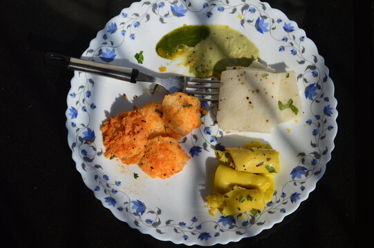 Healthy breakfast with mini idili,khandvi and white dokla.