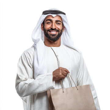 Close-up portrait of a smiling Emirati man in traditional kandura holding a shopping bag, isolated on white background with clipping path.