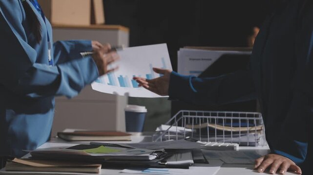 Asian male financial officer or accountant checking investment results Financial budget analysis Planning to summarize results and report to the meeting Audit concept and investment results.