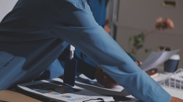 Asian male financial officer or accountant checking investment results Financial budget analysis Planning to summarize results and report to the meeting Audit concept and investment results.