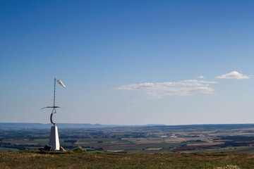 Windsock in Rural Landscape Under Blue Sky