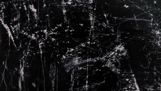 Black grunge texture background with dust, scratches, and noise. Abstract dirty black surface with white scratch marks. Grunge overlay background with copy space.