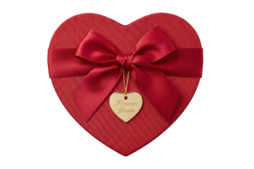 red heart-shaped gift box with red ribbon and forever yours gold charm top view isolated
