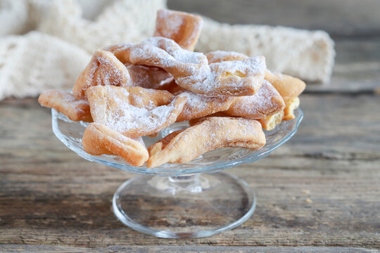 Fat Thursday celebration - traditional Angel Wings cookies decorated with powdered sugar.