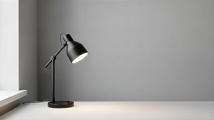 A black metal desk lamp casting a focused beam of light on a white table beside a window in a minimalist room