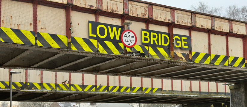 Low Bridge warning on a UK railway bridge. 