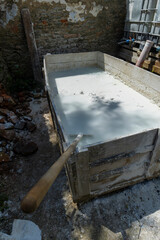 Preparing whitewash in a traditional wooden trough in Markusovce, Slovakia © Richard Semik