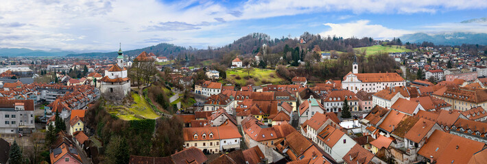 Aerial Panorama of Kamnik Old Town and Mali Grad: Medieval Chapel on a Rock with Kamnik-Savinja Alps, Slovenia Heritage View