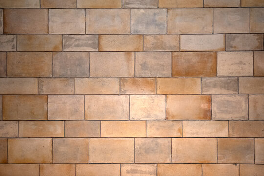 Orange terracotta wall tiles for use as a background texture