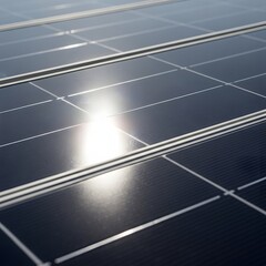 Solar panels reflecting sunlight with glare on photovoltaic cells installed on a rooftop viewed from above