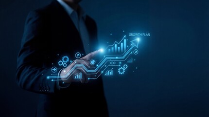 Businessman presenting a futuristic growth plan with glowing blue interface