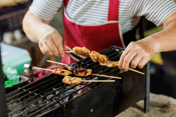 Vibrant night market in Thailand. Street food stalls with delicious local dishes.