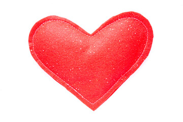 Fototapeta premium Red felt heart handmade toy with white stitching and glitter on white background