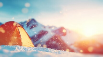 Camping in the mountains during winter with sunlight and snow