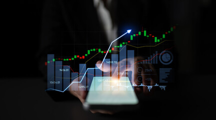 Business professional uses smartphone to analyze financial data, featuring a digital graph and analytics, ensuring informed investment decisions in a modern office. Scalp