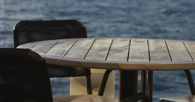 aft deck of a cruise ship with its furnishings and view of the turquoise ocean