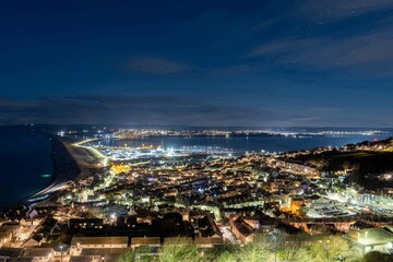 Obraz premium View from Portland Heights of Fortuneswell looking towards Weymouth harbour at night