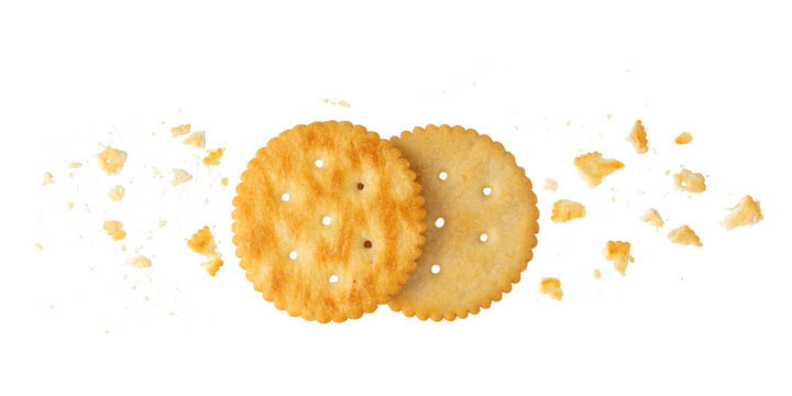 Round crispy cracker cookies with crumbs isolated on white